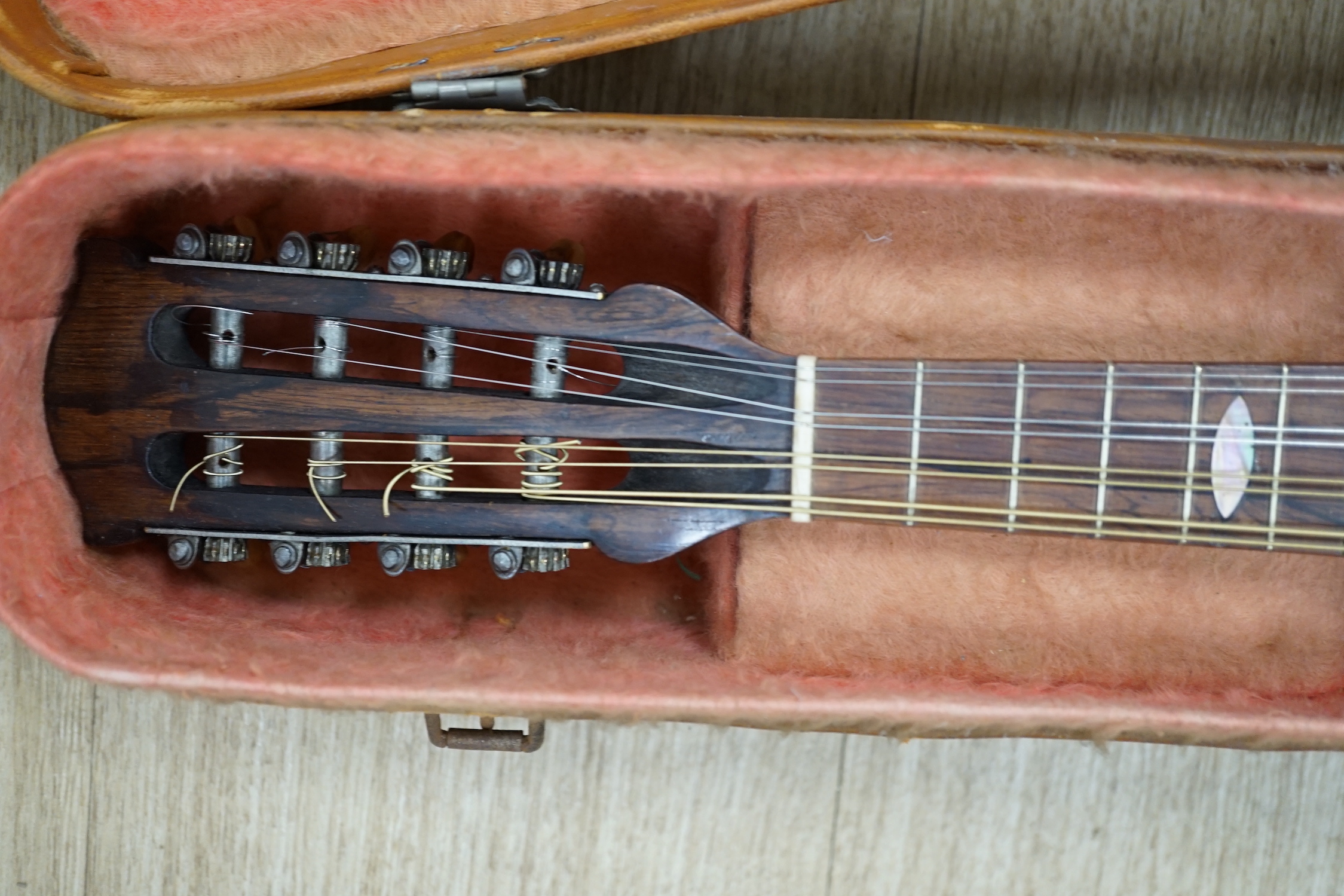 A cased Italian mandolin, labelled Domenico Maratea, and Fratelli Vinaccia, Naples, bowl backed body, length of body 30cm, with some packeted spare strings